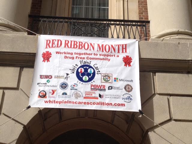 red ribbon white plains cares coalition banner